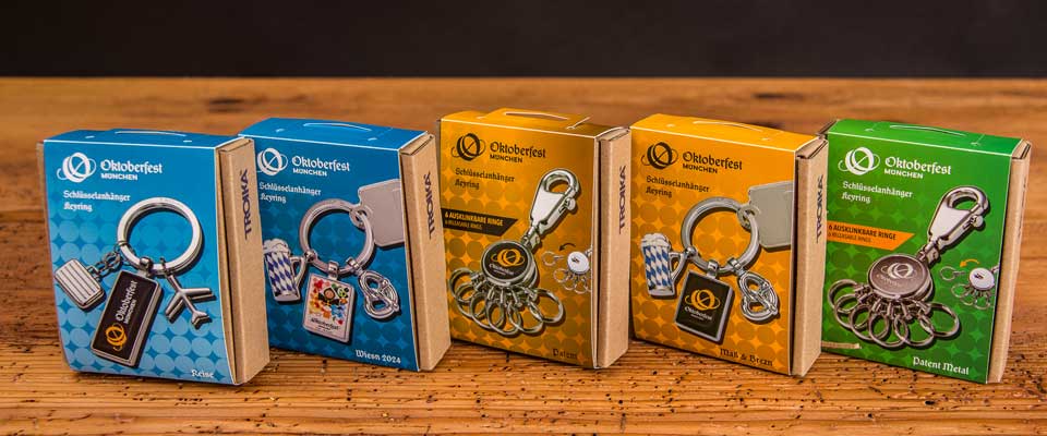 F&uuml;nf unterschiedliche Troika Oktoberfest Schl&uuml;sselanh&auml;nger mit original Oktoberfestlogo als Werbeartikel.