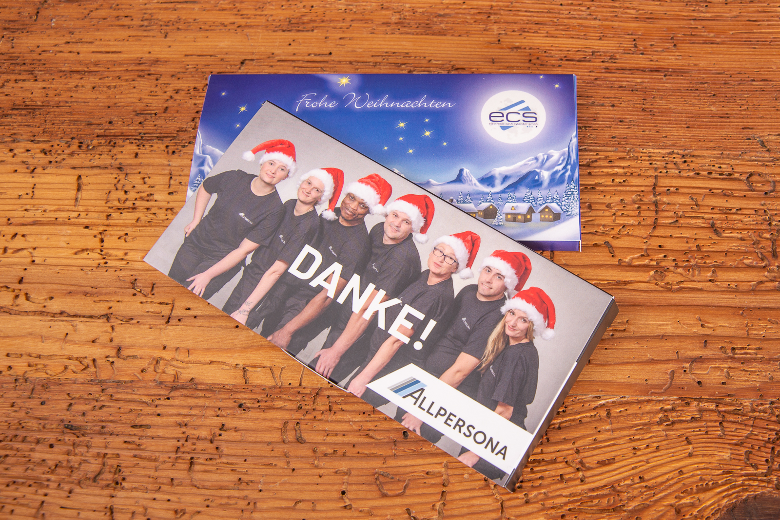 Zwei Schokogru&szlig;karten individuell bedruckt Referenzen ecs und Allpersona als Werbegeschenk f&uuml;r Kunden und Mitarbeiter.