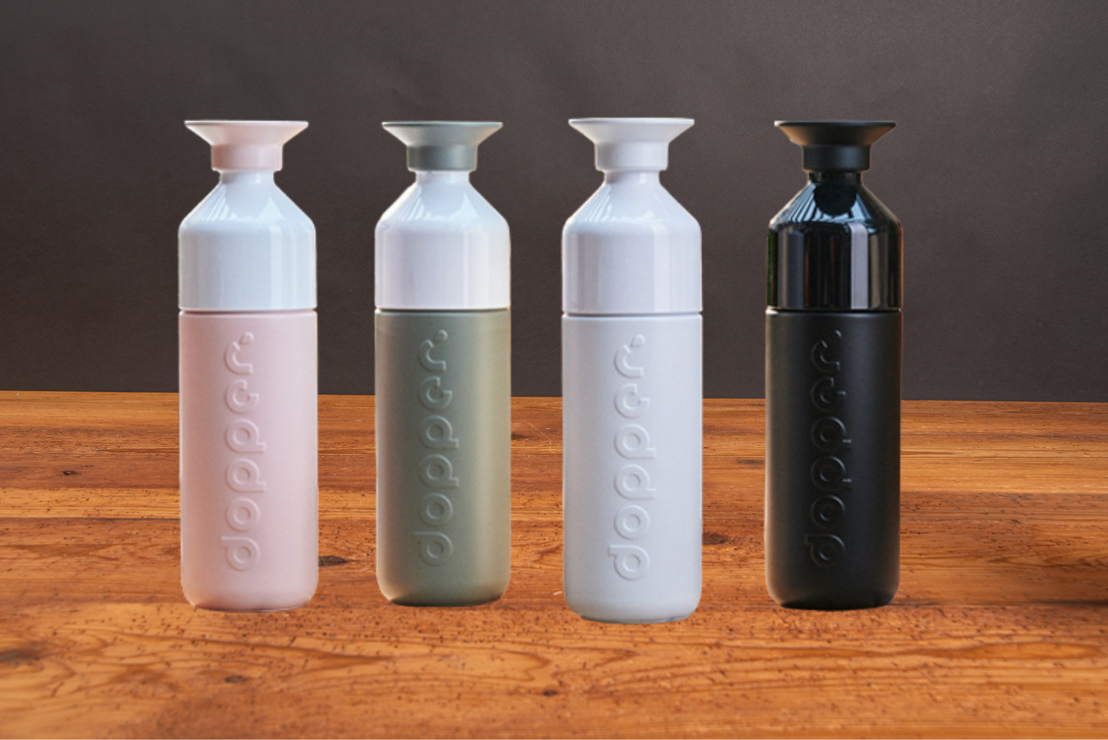 Vier nachhaltige Dopper Trinkflaschen als Werbegeschenke.