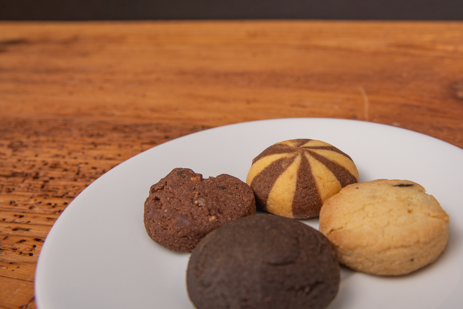 Leckere Cookies in 4 Sorten mit Vanille und Schokogeschmack in einer Einzelverpackung mit Logodruck als Give-away. 