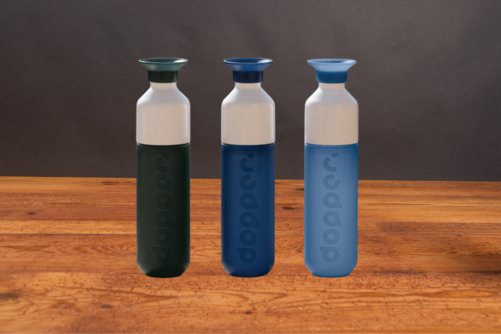 Drei Dopper Trinkflaschen als nachhaltige Werbeartikel.