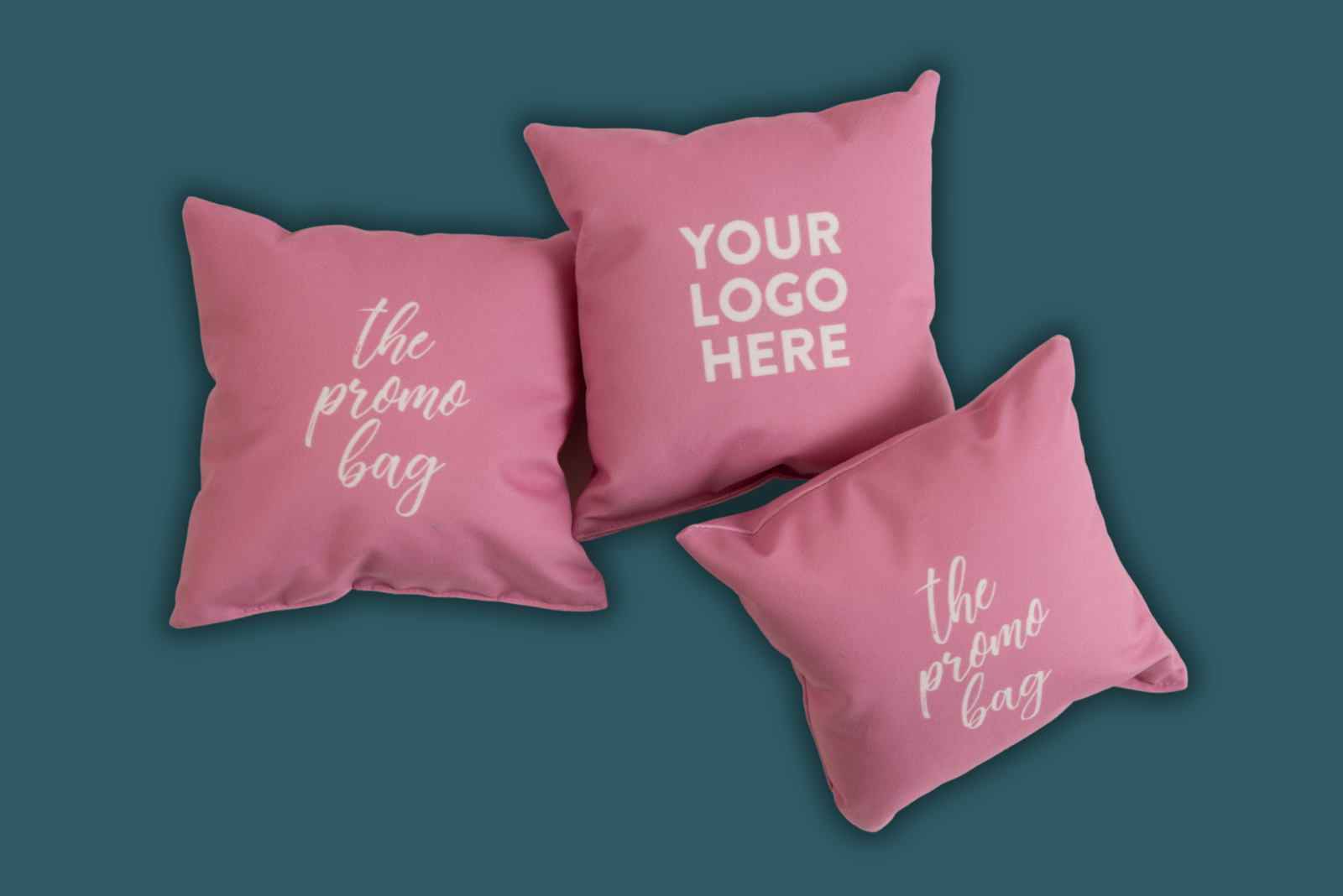 Kissen rosa mit wei&szlig;em Logodruck von MAGMA Heimtex als Werbeartikel.