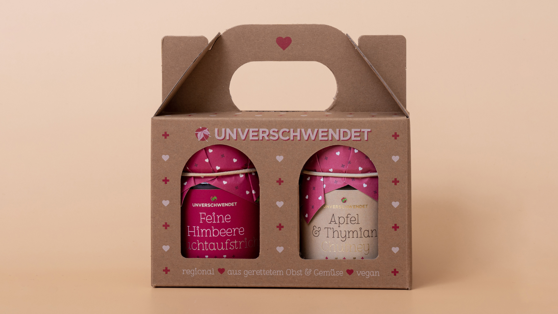 unverschwendet Feinkost Duett Feine Himbeere Fruchtaufstrich und Apfel & Thymian Chutney in der Geschenkverpackung als Werbegeschenk.
