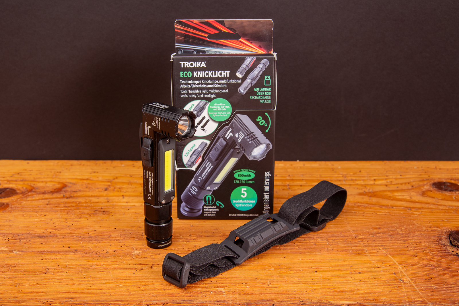 TROIKA ECO Knicklicht mit Verpackung und Stirnband &ndash; multifunktionale, wiederaufladbare LED-Taschenlampe mit Logo als nachhaltiger Werbeartikel f&uuml;r Handwerk, Outdoor und Sicherheit.