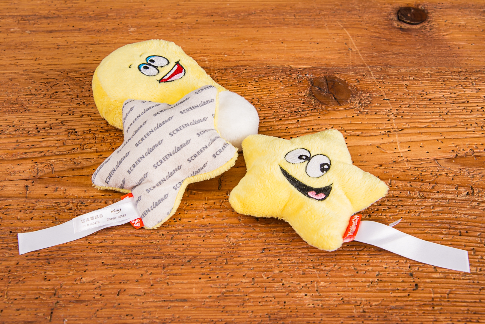 Lustige Schmoozies Displayreiniger in Form von Gl&uuml;hbirne und Stern als origineller Werbeartikel.