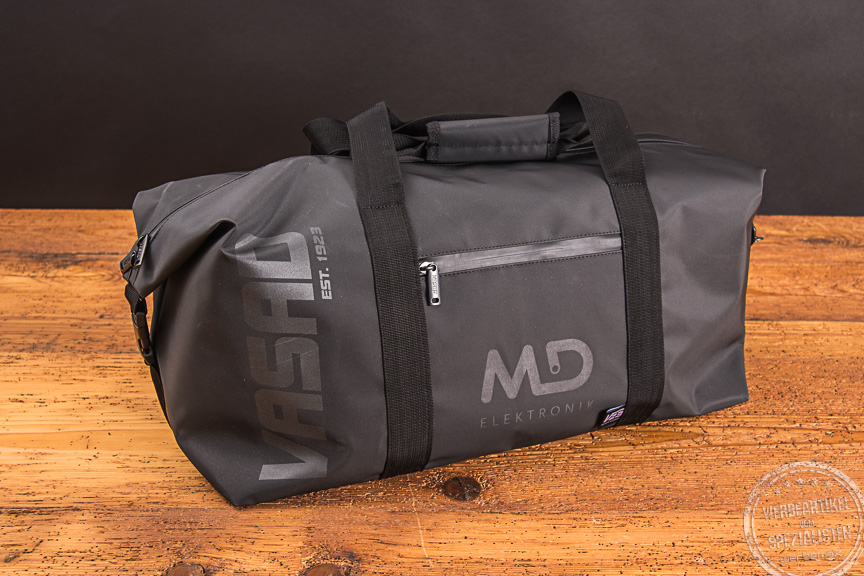 Graue Vasad Sporttasche mit Logo md elektronik als Mitarbeitergeschenk.