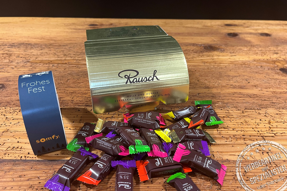 Rausch Schokolade in der Goldbox mit Werbebanderole