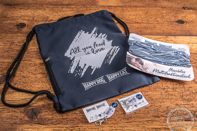 Happy Dog Happy Cat Werbeartikel dunkelblauer Matchrucksack mit weißem Logodruck, individuelles MUFU und Einkaufswagenlöser