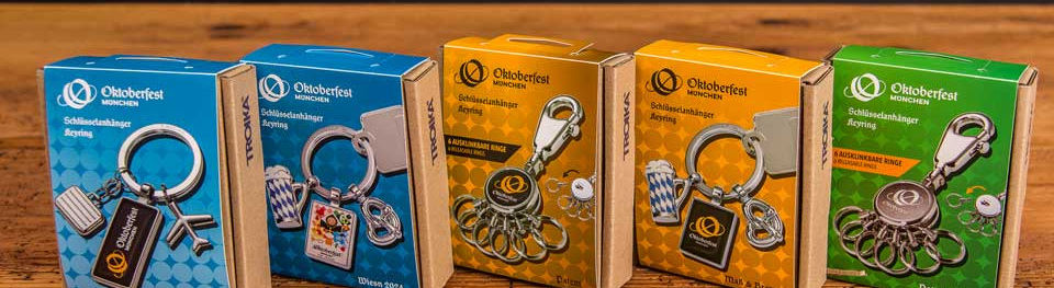 Fünf unterschiedliche Troika Oktoberfest Schlüsselanhänger mit original Oktoberfestlogo als Werbeartikel.