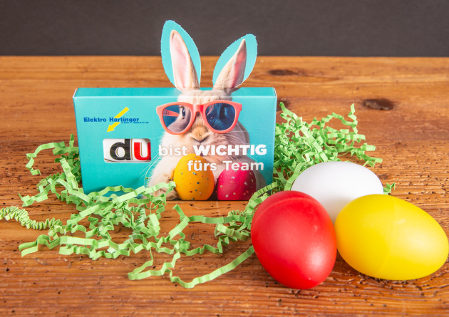 Duplo-Schokoriegel im 3er Werbekarton mit Hasenohren und dem Aufdruck "Du bist wichtig f&uuml;rs Team" als Werbeartikel f&uuml;r Mitarbeiter und Kunden. 