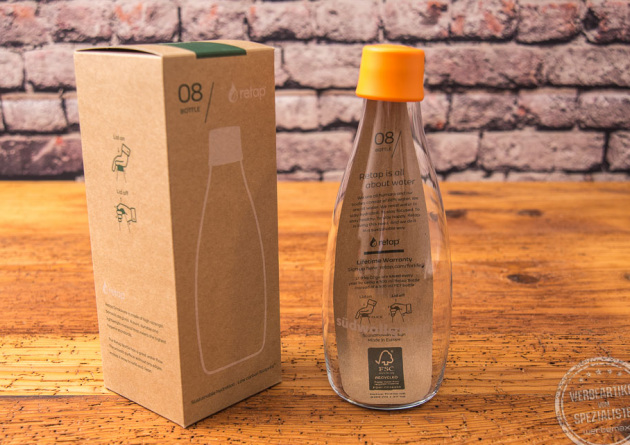 retap flasche mit Verpackung und gelbem Deckel 