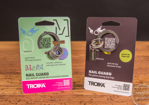 Zwei Troika Schlüsselanhänger Nail Guard in der Verpackung. 