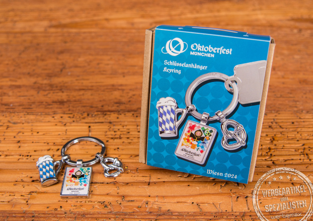 Schl&uuml;sselanh&auml;nger zum Oktoberfest der Marke Troika. Die drei Anh&auml;nger sind ein bayerischer Ma&szlig;krug, das Oktoberfest-Logo und eine bayerische Brezl