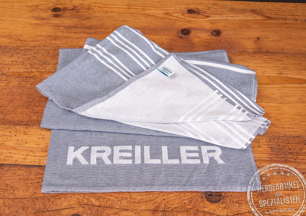 Strandtuch mit Logo-Einwebung als Werbeartikel.