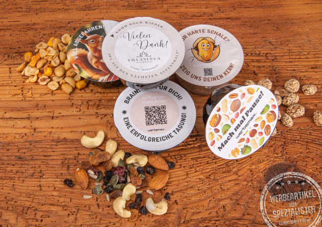 Nutsbox Nussmischungen in der Schale mit Logo auf Deckel als Werbemittel.