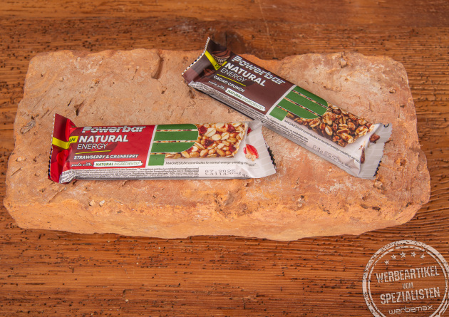 Energyriegel als Werbeartikel in 2 Sorten. Cacao Crunch und Strawberry Cranberry, jetzt als Werbeartikel gestalten.