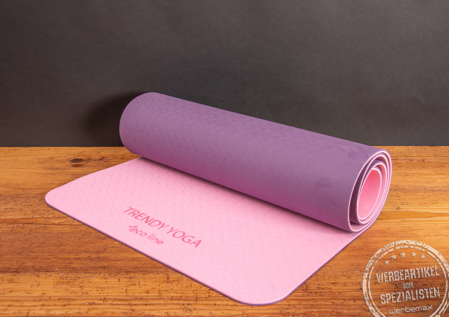 Yogamatte als Mitarbeitergeschenk für Gesundheit und Balance. In verschiedenen Farben. Hier in Lila und auf der anderen Seite in rosa. 