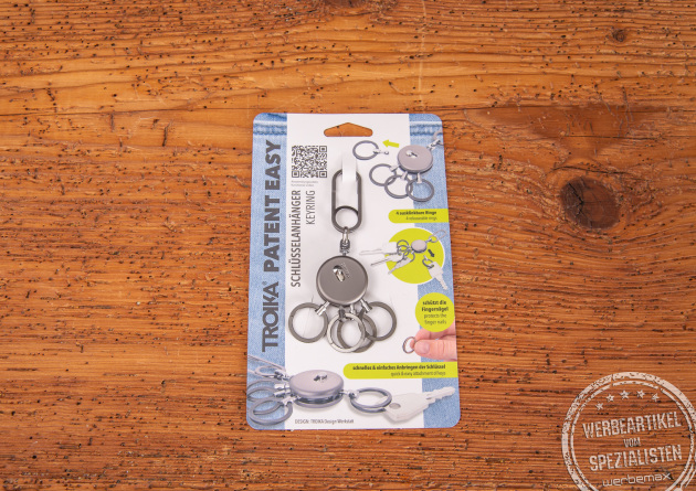 TROIKA PATENT EASY Schlüsselanhänger in Blisterverpackung mit Karabinerhaken und vier ausklinkbaren Ringen – hochwertiger Werbeartikel aus Metall und Messing, ideal zum Gravieren mit Logo.