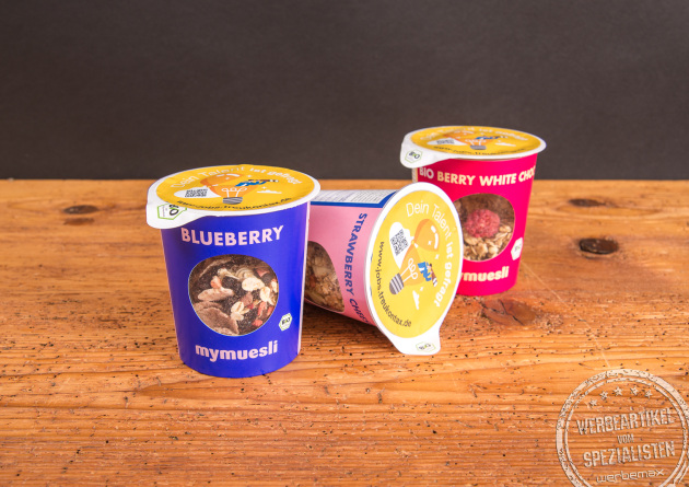 Bedruckte mymuesli Becher to go – individuelles Giveaway mit Logo für Messen und Events.