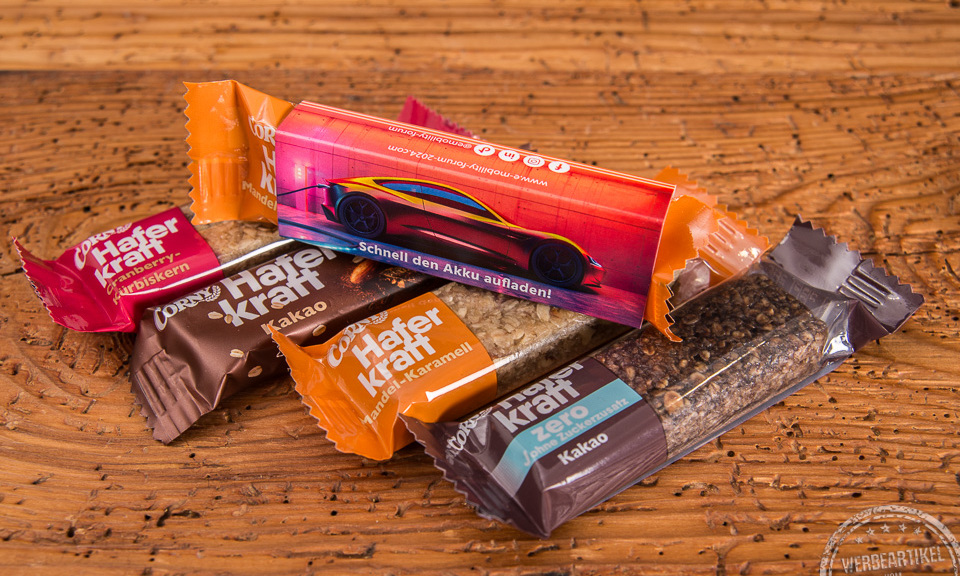 Corny Haferkraft und Corny Müsliriegel jetzt auch als Werbeartikel im beddruckten Kartonschuber bestellen.