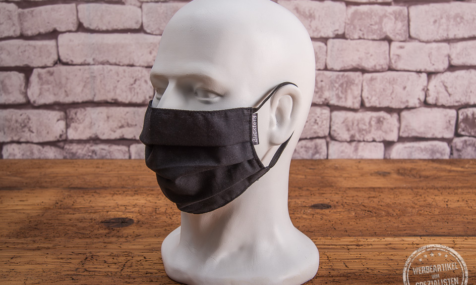 Schwarze Mund-Nasen-Maske aus Baumwolle mit Weblabel