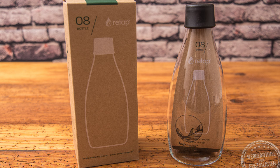 Flasche von Retap mit Verpackung aus Glas mit schwarzem Deckel als Werbeartikel