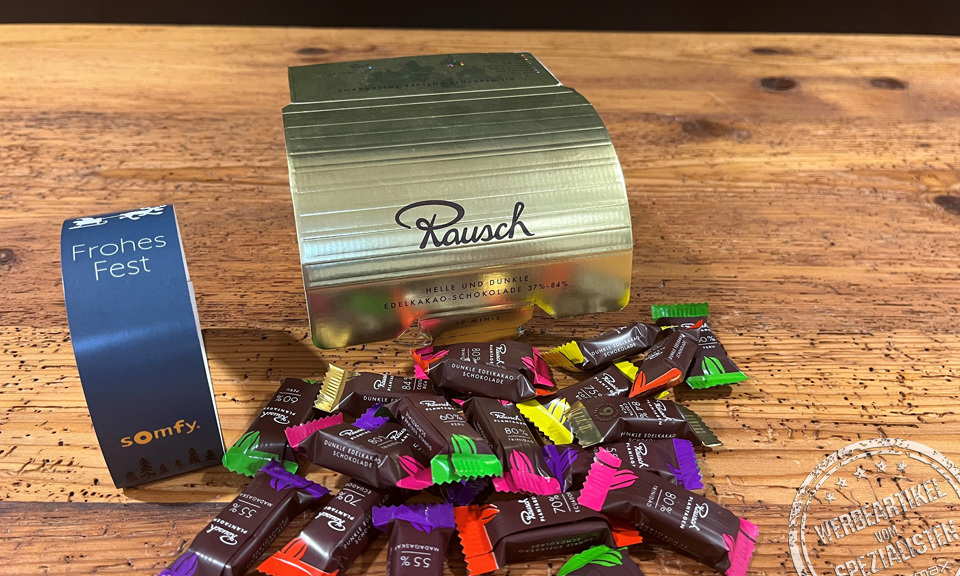 Rausch Schokolade in der Goldbox mit Werbebanderole
