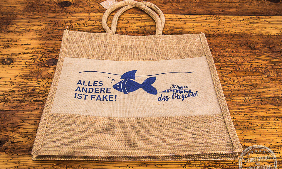 Jutetasche mit kurzen Henkeln. Blauer Aufdruck der Firma P&ouml;ssl