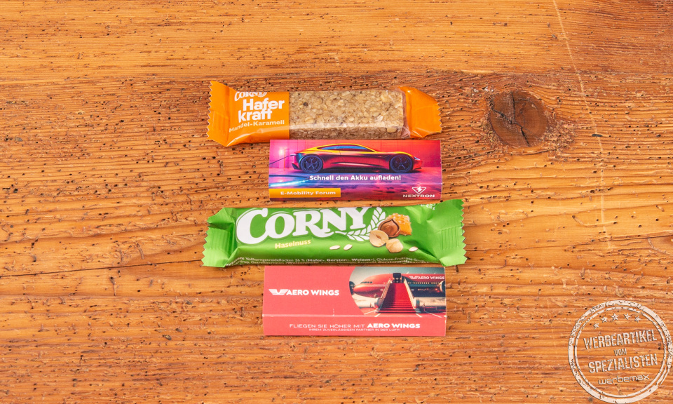 Haferkraft Riegel und Corny Müsliriegel als Werbeartikel bestellen mit Kartonschuber im Digitaldruck zu personalisieren.
