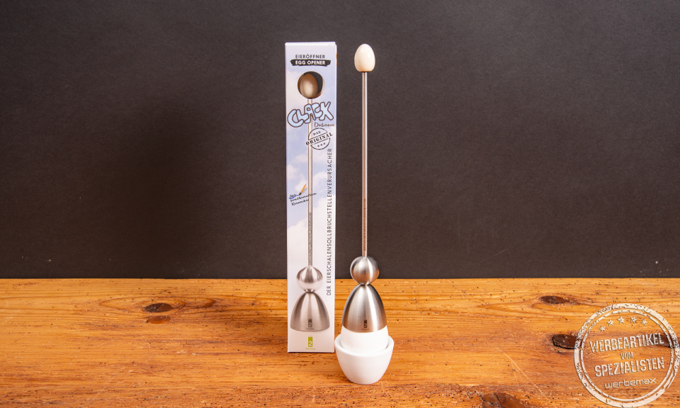 Original Clack Eierschalensollbruchstellenverursacher von take2 – Edelstahl-Design mit Verpackung im Fokus.