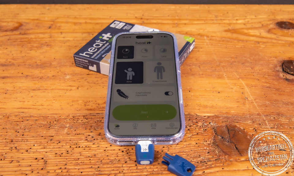 heat it Insektenstichheiler mit Smartphone und Verpackung – chemiefreier Werbeartikel gegen Mückenstiche, ideal für Sommer und Outdoor.