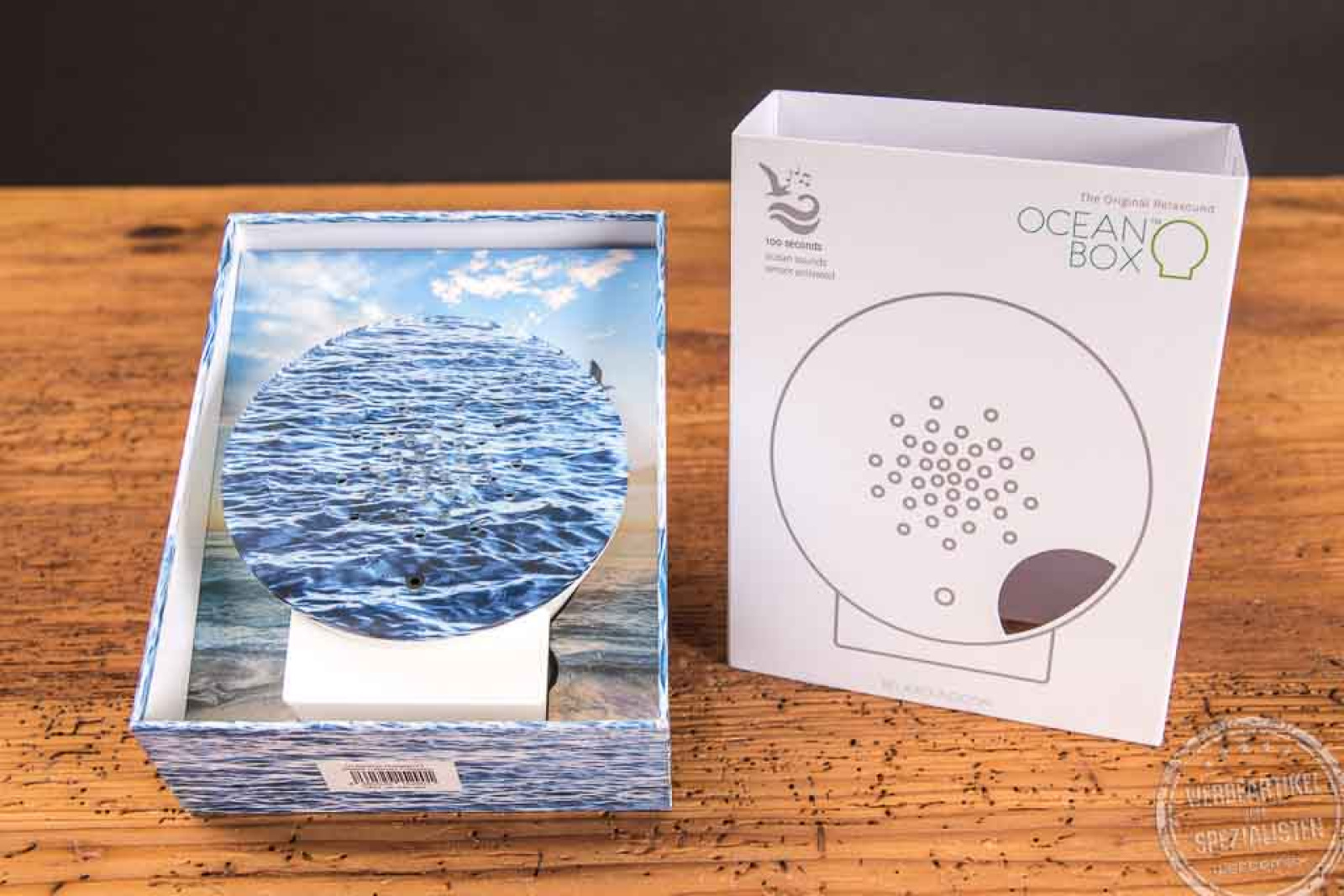 Runde Oceanbox mit Acrylfront mit Meeraufdruck inklusive Verpackung als Werbegeschenk.