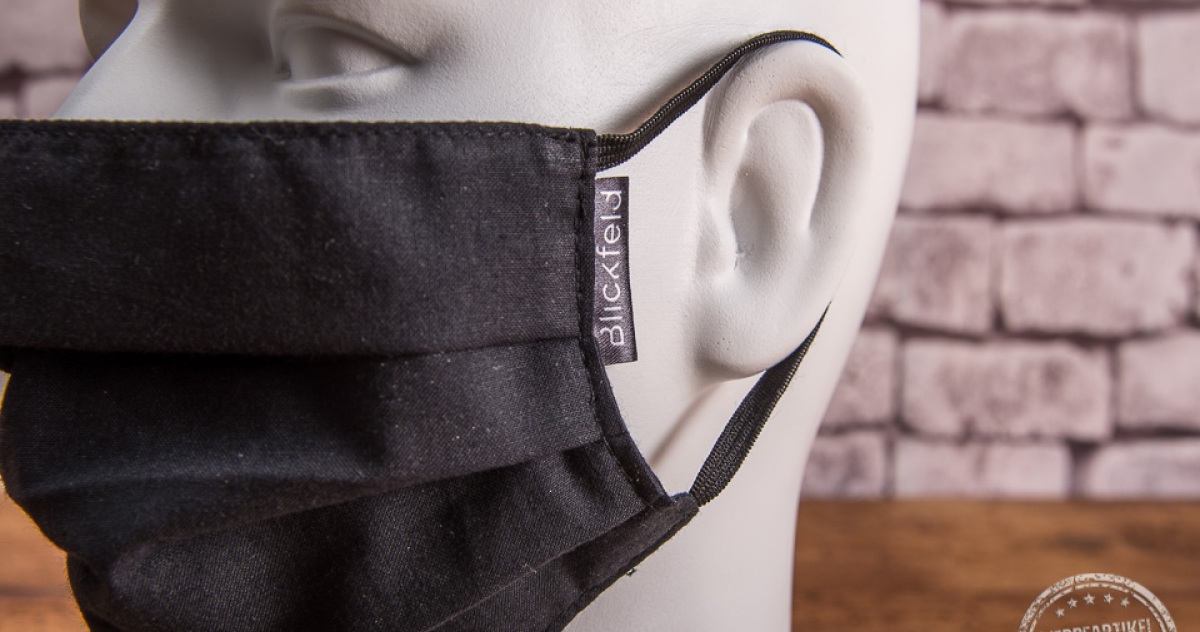 Schwarze Mund-Nasen-Maske aus Baumwolle mit Weblabel