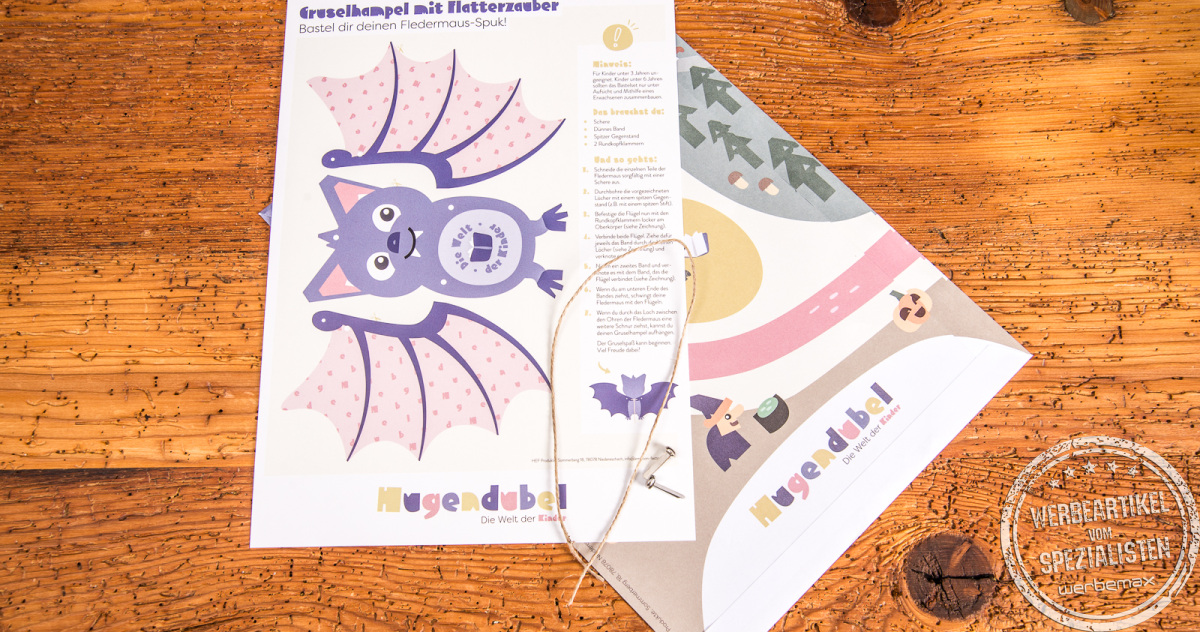 Halloween-Bastelbogen von Hugendubel mit Fledermaus-Elementen, Kordel und Musterteilen – kreatives Bastelset für Kinder.