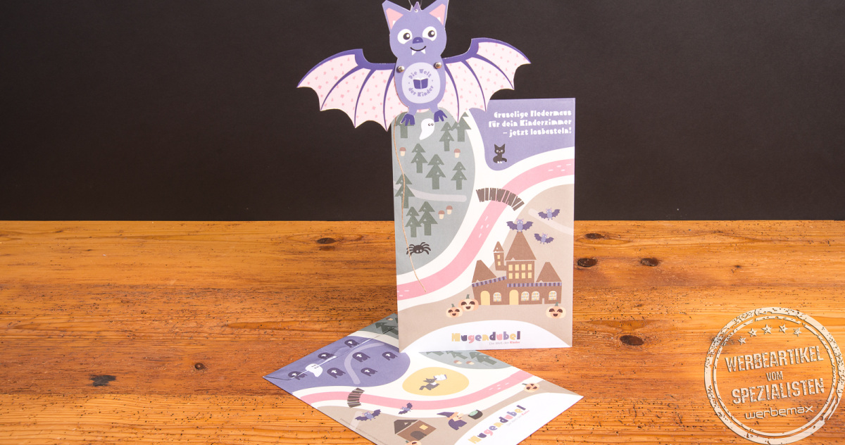 Komplettes Halloween-Bastelset von Hugendubel mit Fledermaus-Hampelfigur und bebildertem Bastelbogen für Kinder.