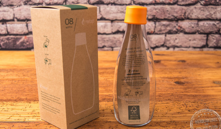 retap flasche mit Verpackung und gelbem Deckel 