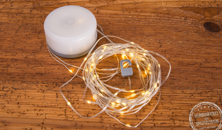 8m lange Lichterkette als Outdoorlampe. Innovatives Werbegeschenk mit Ihrem Logo als Domingaufkleber.
