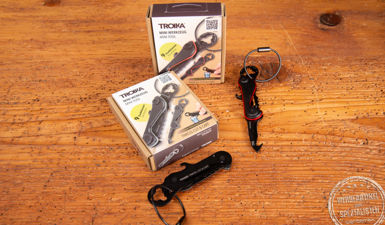 TROIKA Multitool PARCEL CUT & CART als Werbegeschenk – Minitool mit Logo und Verpackung in Schwarz und Rot