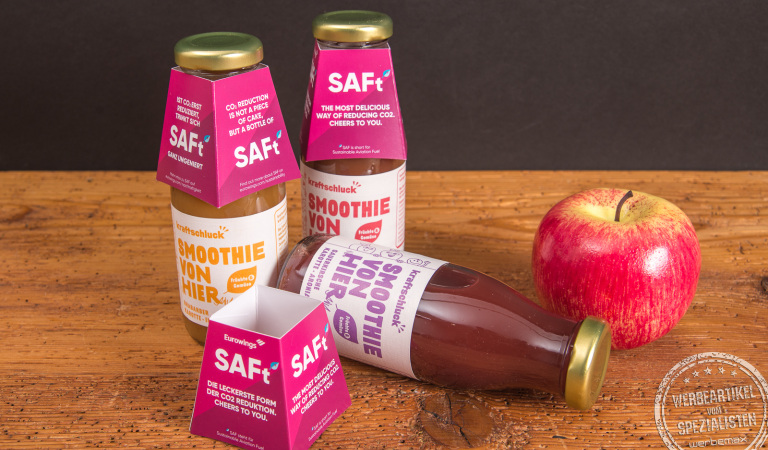 Kraftschluck Bio Smoothie mit pinker Verpackung und Apfel – gesunde Werbegeschenke mit Logo aus regionaler Herstellung